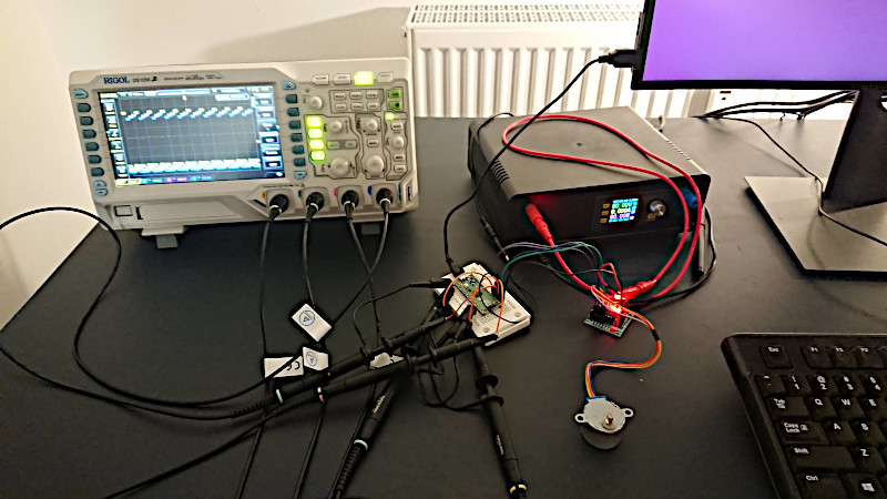 Experiment setup of stepper wired to oscilloscope.